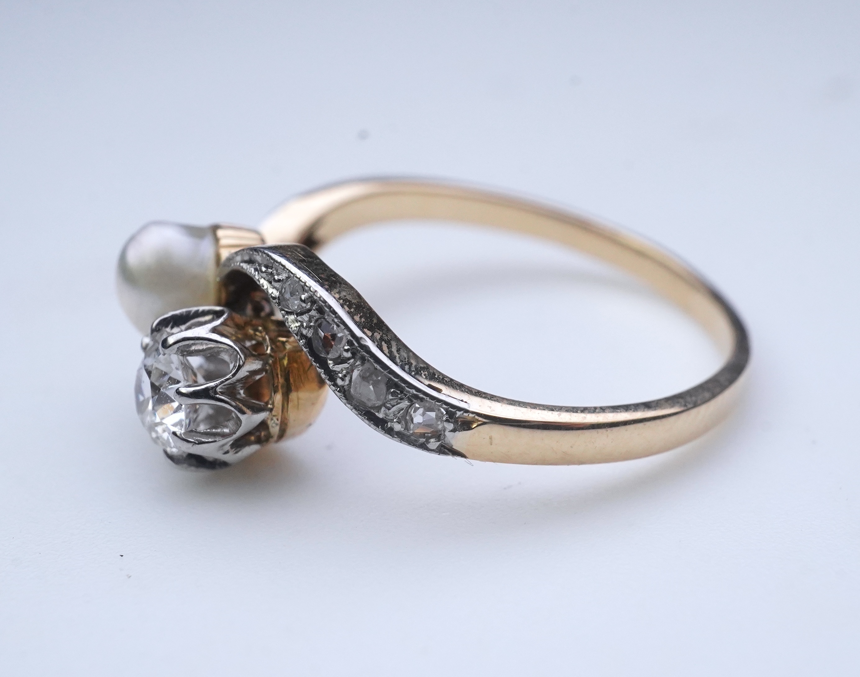A pearl and diamond toi-et-moi ring, early 20th century
